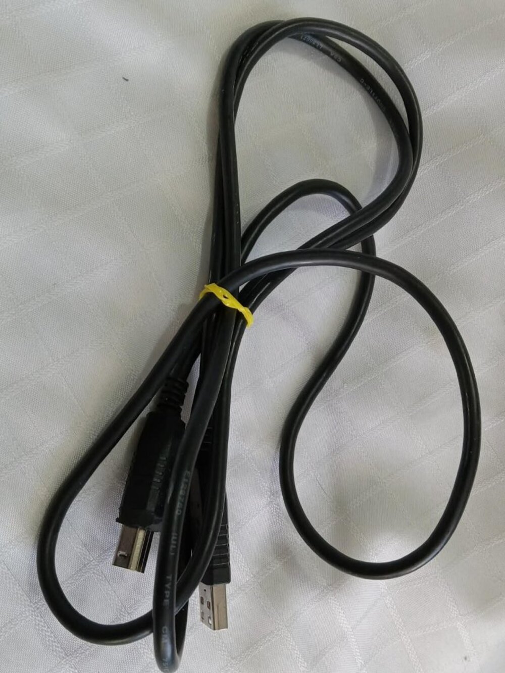 Type A USB connector on one end and a square Type B connector on the other